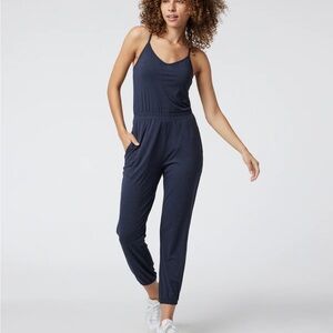New with the tags, Vuori Lux jumpsuit midnight Heather